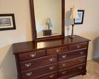 #56	9 drawer "cherry" wood dresser w/mirror.	 $ 175.00 																							