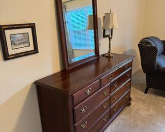 #56	9 drawer "cherry" wood dresser w/mirror.	 $ 175.00 																							