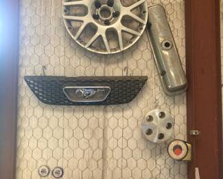 The sale has lots of hubcaps, including Buick and Ford, and lots of Volkswagen car parts.