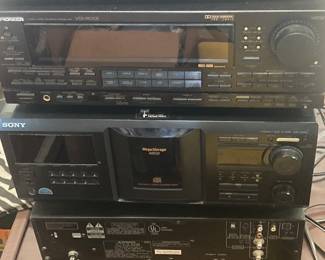 There’s a receiver and a laser disk player among these components.