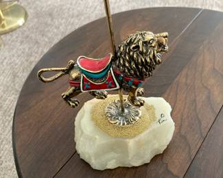 Brass carnival lion on onyx base