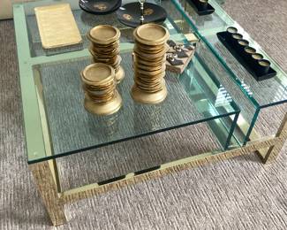 Glass and brass coffee table, gold candlesticks and other accessories