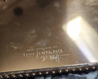 Reverse of trivet, "Made exclusively for (the) Tiny Jewel Box, signed by artist/jewler.