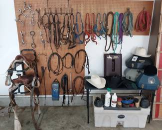 13” and 12” western saddles, 50x black cowboy hat, 5x and 25x cream Resistol hat, summer hoods and sheets, coolers, garment bags, bridal bags, lasso, English and western saddle pads, feed bag, Lariat and rope bag, hard hat cans, boot carrier, saddle racks, water and tack caddie, headstalls, bits, halters, reigns, breast collar, riding crops, leg wraps, lead ropes, lunge lines, bell boots, brushes