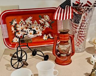 Vintage Mid Century Modern Daisey Tray; American Hand Flags; Glass Vase; Two 1980s Kool Aide Plastic Mugs; Vintage Petite Oil Lantern in Red Metal; Table Top Trike Decor