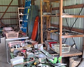 Large barn filled with equipment, supplies and loads of electric and hand tools.
