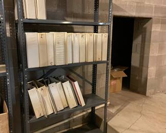 many note books & metal shelving