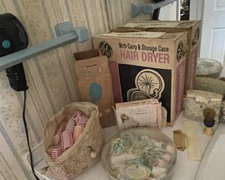 Vintage hair dryer and curlers.