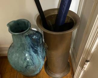 Glazed turquoise vase and vintage Hollywood regency hammered umbrella stand.