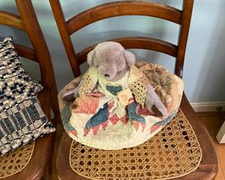 Child's chair with toy dog.