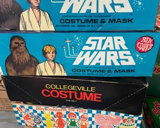 Stars Wars and Collegeville Costumes in boxes.