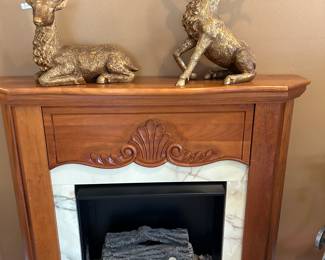 Faux fireplace, wood mantel, log insert.  Can go in any room.