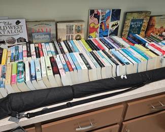 books & Star Wars light saber