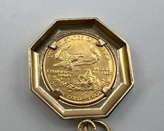 1987 1/10 oz gold Eagle set in 14kt gold. 