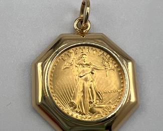 1987 1/10 oz gold Eagle set in 14kt gold. 