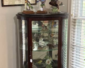 Small lighted China cabinet with Boehm collectibles. 