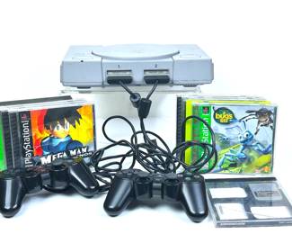 Vintage Sony PlayStation console, controllers and games