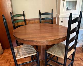 Antique round dining table and four ladder back chairs 