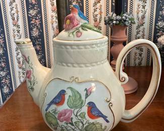 Adorable lidded hot tea pitcher with blue birds painted and adorned at top 