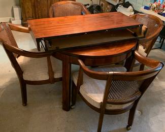 #72	round table with 2 leaves and 4 chairs on wheels 40-72x29 t	 $250.00 
