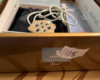 #115	Lladro Privilege Gold Talimnia Pendant on Rope  "Zodiac"01010004	 $30.00 
