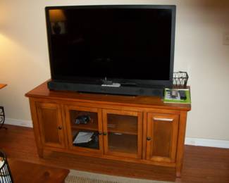 Wood 4 Door Media cabinet ;  2011 Insignia 46 inch TV with remote.