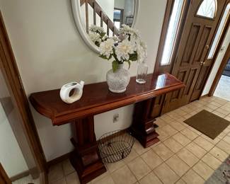 Even the entry way of this beautiful home has a piece of lovely furniture!