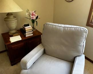 A great little side upholstered side chair and table in the primary bedroom! 
