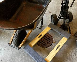 The garage is filled with great usable treasures! How about a nice metal wheel barrow! (Needs air in tire) or a Gold Lady Cart or a Milwaukee Flat Dolly! 