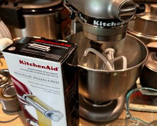 A very nice Silver/Gray KitchenAide Mixer with accessories! 
