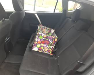 Colorful cooler tote is not included with the purchase of the vehicle.