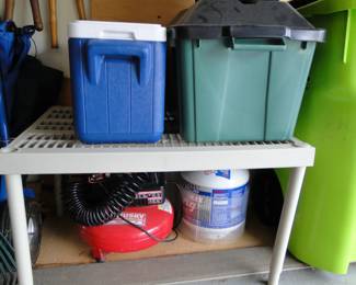 Air compressor, and propane tank, an extra one for the drill, a cooler, and storage bin