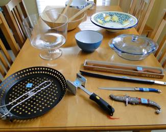 Truffle it, serve it, toss it, smash it, cut it and poke it.  And really have no idea as to the black perforated item on the lower left