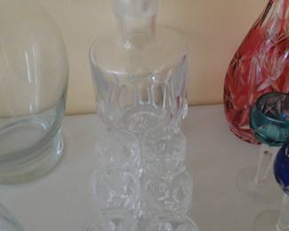 Kinda a blurry picture, but what we have here, is a Baccarat crystal decanter with a matching set of six glasses.  Totally Mid Century Modern