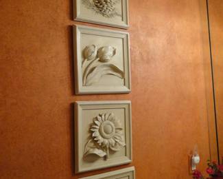 Four square wall plaques, great detail in the relief on each one. 