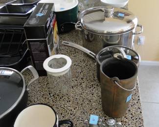 Pots, pans and unique kitchen items, and some small salt and pepper shakers too