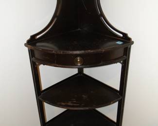 Four shelves (teeny tiny one on top) + Drawer+ Corner design = Corner side table with drawer. Obviously.