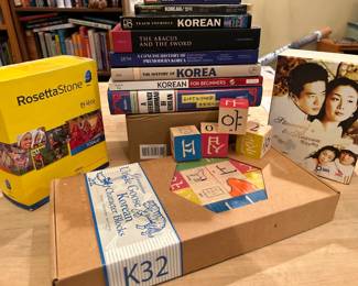 Learn Korean.  Books, blocks. movies, Rosetta Stone.