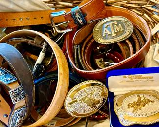 Tons of leather belts and rodeo buckles