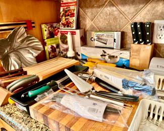 Lots of hunting and fishing knives, pampered chef