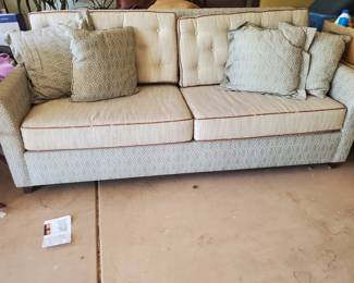 This sleeper sofa is in storage. The leather stripping is cracking.  It is a solid piece, I would take $75 for it.