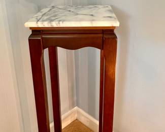 Tall, cherry plant stand with marble top
