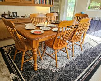 Dining table with one leaf and six chairs
