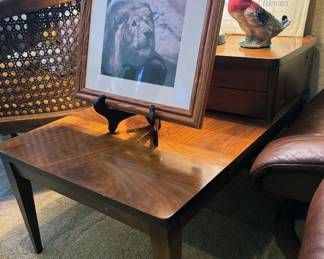 Mid-century end table, wicker chairs, framed animal photographs