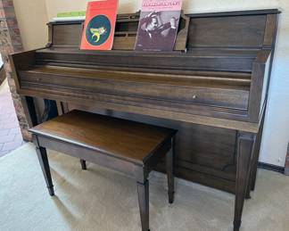 Upright piano with bench + assorted sheet music