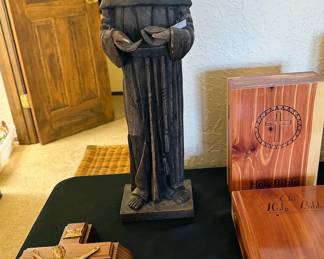 Various religious idolatry, including a statue of St Francis, crosses, Mary