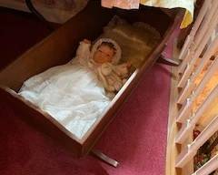 Dolls and wooden cradle