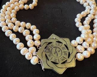 Fresh water pearl necklace with a Yin/Yang Buddhist symbol set in sterling 