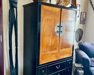 Elognated African carving from the Makonde tribe, Tanzania. Chinese cabinet, and vintage  Balinese shadow puppets 