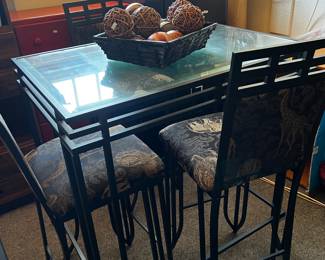 High top table with animal upholstered chairs